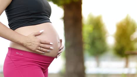 pregnant woman doing sports fitness for pregnant women pregnant woman is engaged in physical exercise in the nature fitness for pregnant moms