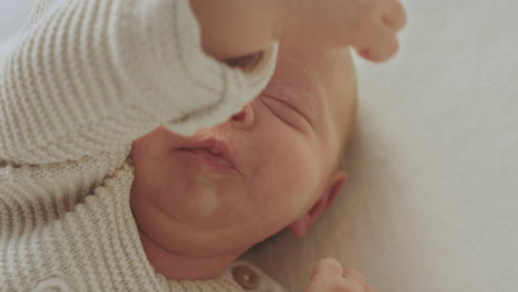 sleeping baby in knitted sweater