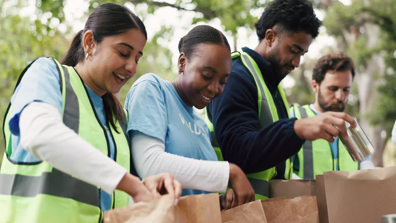 Diverse Group of Volunteers Packing Food Donations Outdoors