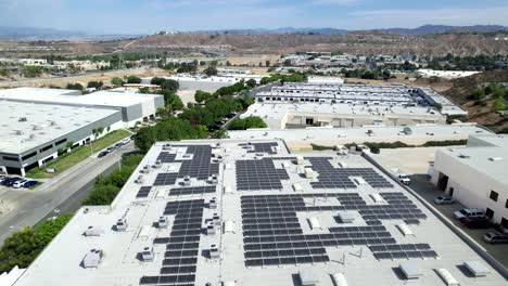 Solar-panels-on-a-large-commercial-complex-provide-clean-and-efficient-energy---aerial-flyover