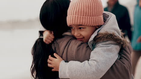 kid, hug and mother at beach with happiness