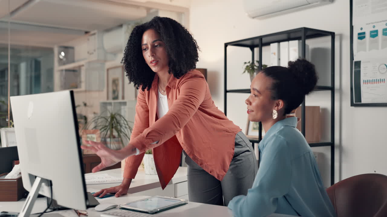 Two women collaborating in an office