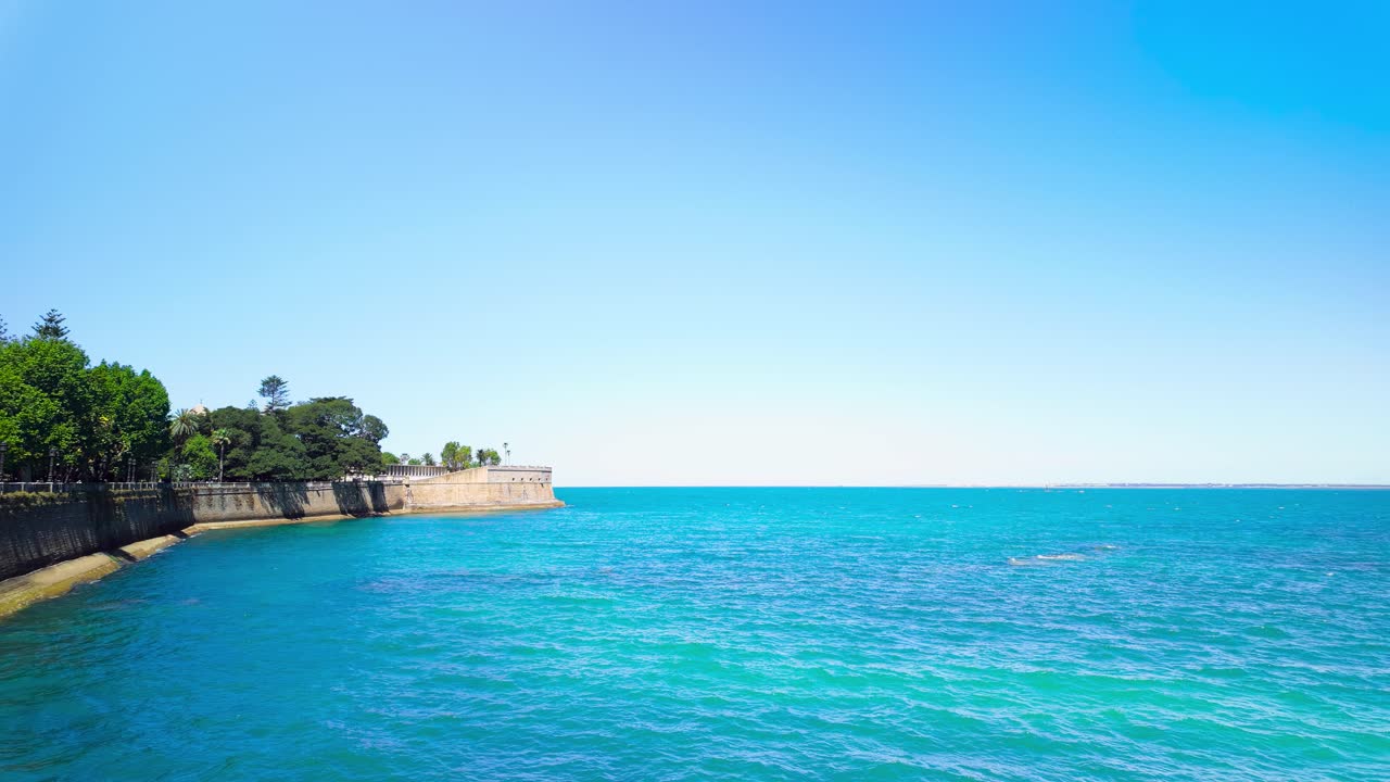 Calm ocean at Cadiz, Spain, on a day with clear blue sky