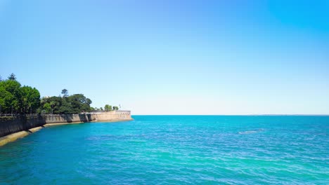 calm ocean at cadiz, spain, on a day with clear blue sky