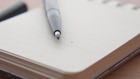 open notebook with pen