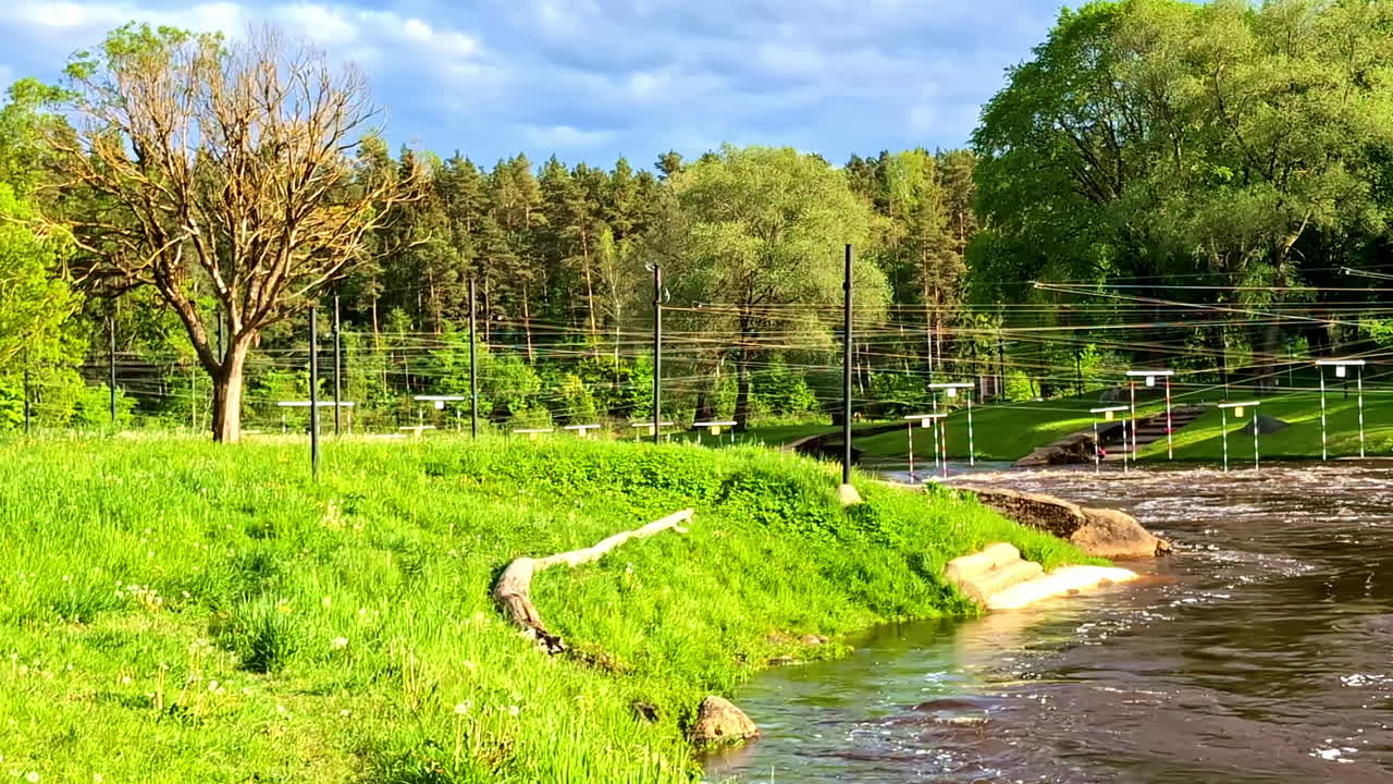 Slalom kayak course on rapid river section with hanging poles in Valmiera, Latvia