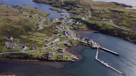 Birds-eye-view-drone-shot-of-the-Isle-of-Scalpay,-an-island-near-the-Isles-of-Harris-and-Lewis-on-the-Outer-Hebrides-of-Scotland