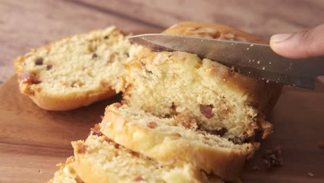 sliced fruitcake on a wooden board