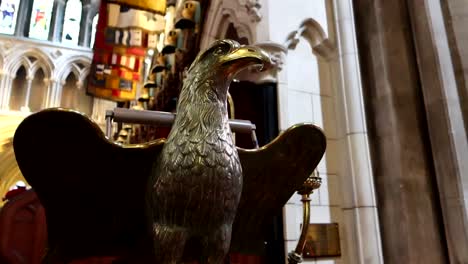 low angle shot of a golden eagle statue inside of st patrick's cathedral, dublin, ireland