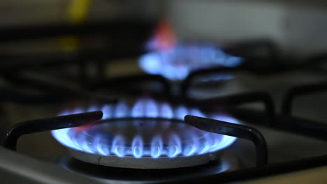 close up of two gas burners, focusing from one to another