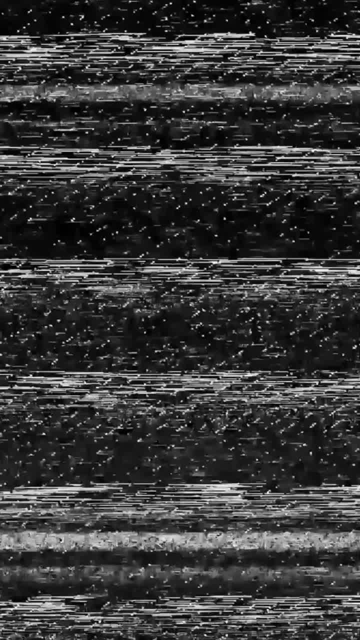 Intense vertical black and white TV static noise with heavy glitch distortion, perfect for creating a chaotic, broken screen or horror atmosphere