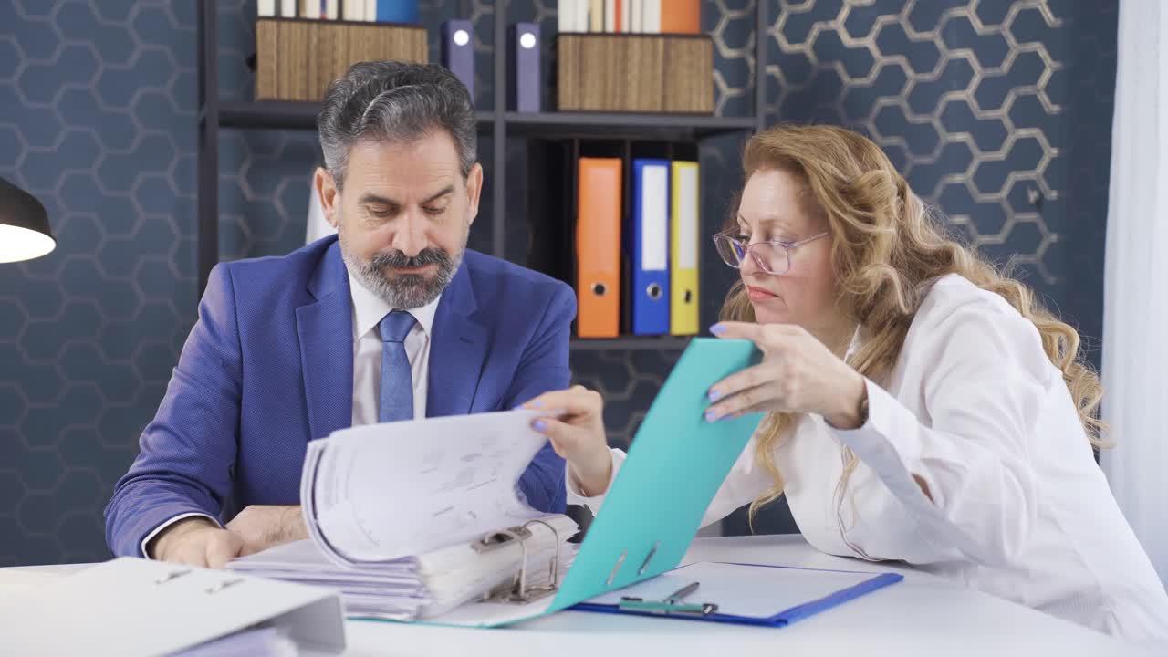 Office workers who are bored and overwhelmed by a crowded file.