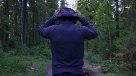 man hiking in forest