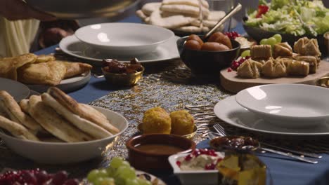 close up of food on muslim family table at home set for meal celebrating eid 3