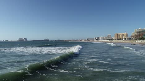 A-Drone's-Eye-View-of-the-City,-Beach,-and-Sea