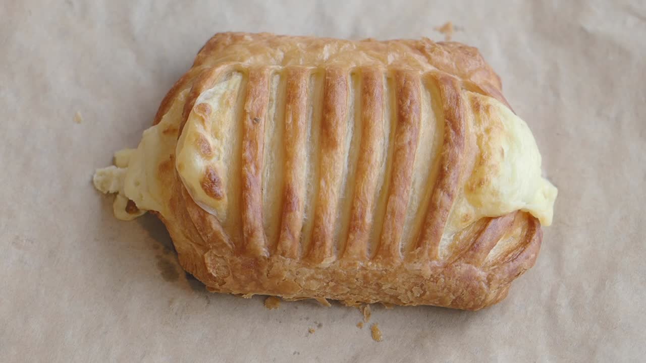 Hand holding a cheese danish