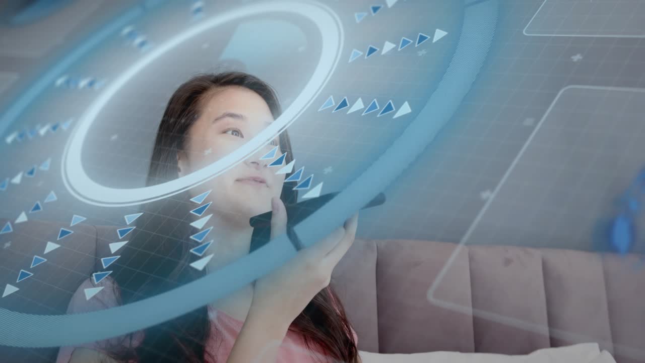 Woman in bed speaking and smiling into smartphone for communication, AR HUD ring rotating over face