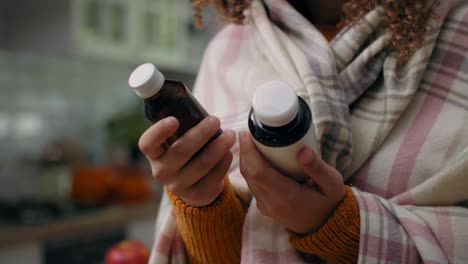 Woman holding bottles of remedy for her illness/Rzeszow/Poland