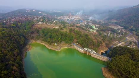 dam with pristine lake at the edge of mountain forests aerial shots at morning video is taken at umiyam lake shillong meghalaya india