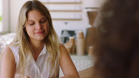 two women having a coffee conversation