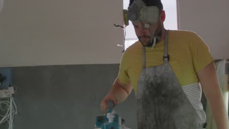 male surfboard maker in his workshop