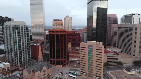 short aerial pan of inner downtown denver colorado with a church and  traffic