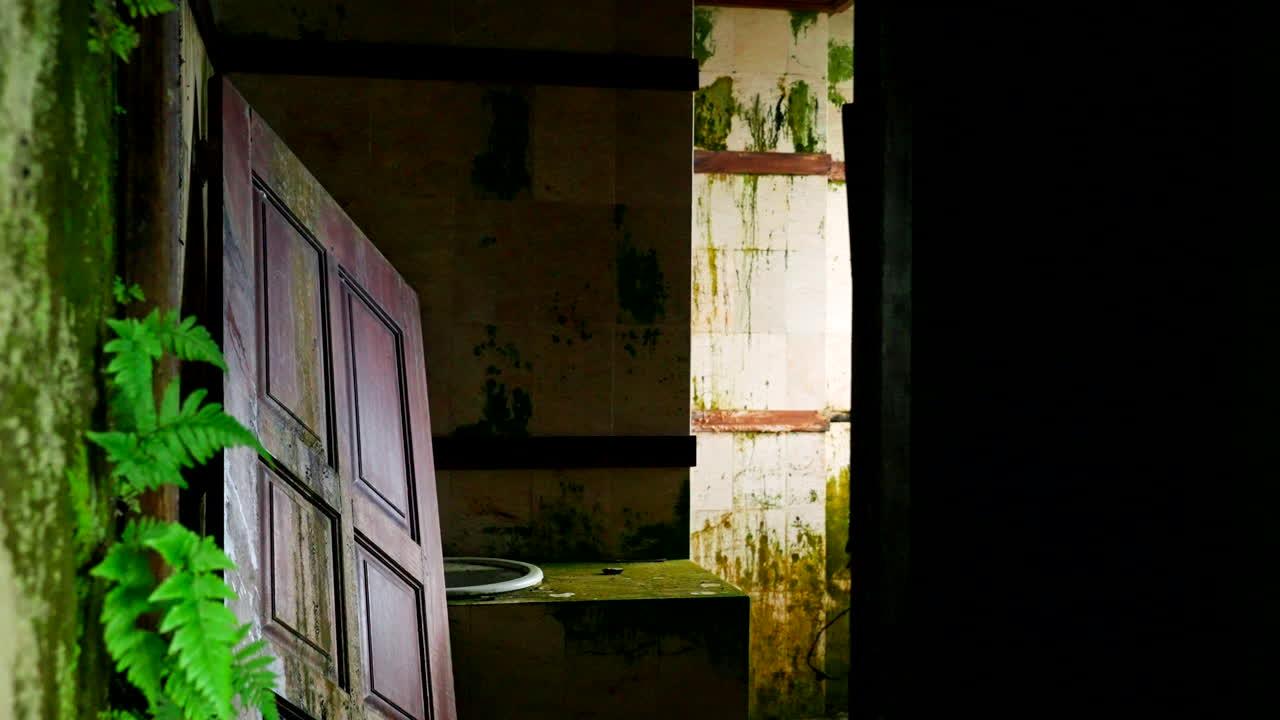 Dilapidated Architecture Covered With Moss On The Abandoned Ghost Palace In Bali, Indonesia