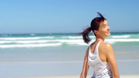 portrait of beautiful woman enjoying at beach