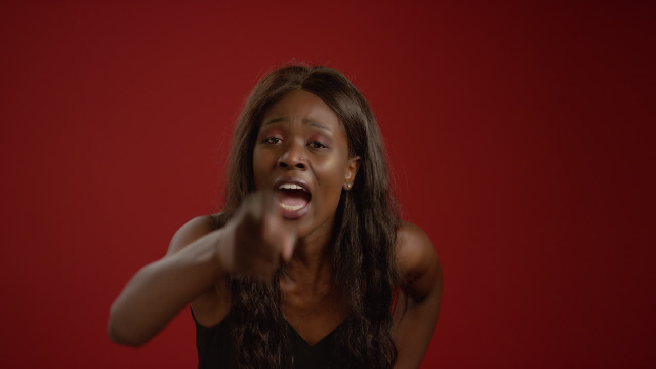 Woman Points and Shouts at Camera