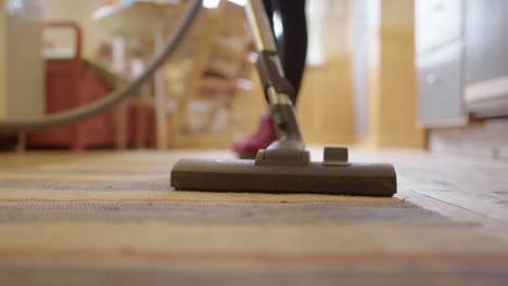 housekeeping chore of vacuum cleaning a carpet