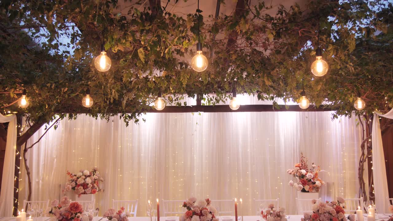 Shot of beautiful dinner table decoration with candles lighted up