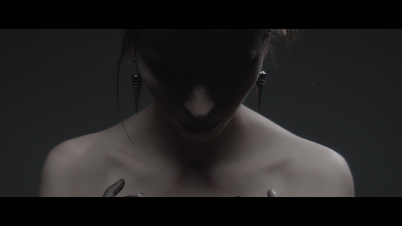 A woman dressed as mother nature rise her head