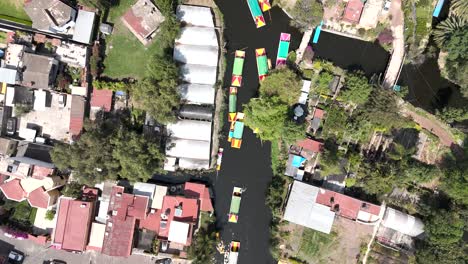 Aerial-view-of-the-Xochimilco:-drone-images-capture-the-bustling-canals-and-colorful-trajineras