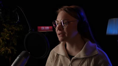 woman podcast host in studio
