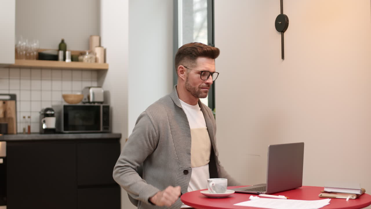Man Starting Working at Laptop Computer