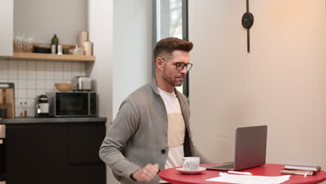 man starting working at laptop computer