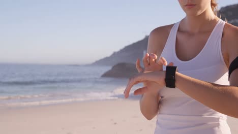 portrait of woman is using connected watch