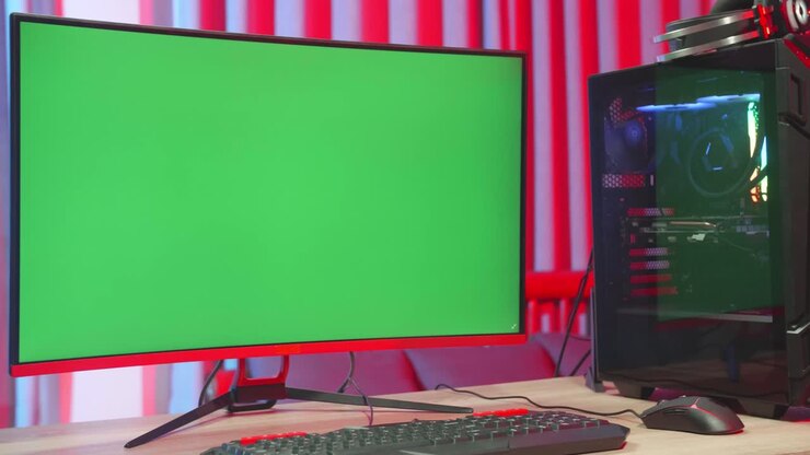 PC da gaming con monitor a schermo verde a casa