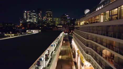 huge cruise ship docked in the harbor with the city of montréal in the background