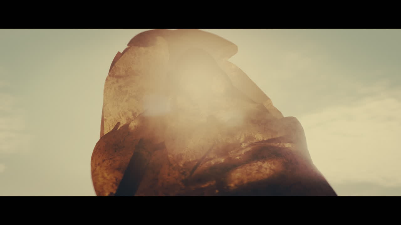 Huge golden statues in the desert during sunset