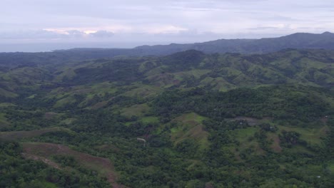 Tilt-up-shot-of-the-Lapale-Hills-at-Sumba-island-during-sunset,-aerial