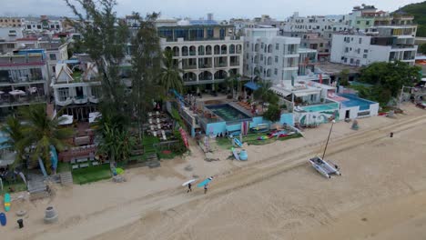 Surfers-on-Vacation-Holiday-on-Sanya-Beach,-Hainan-Island,-China