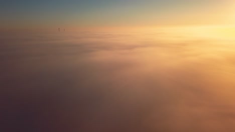 sun rising above the clouds