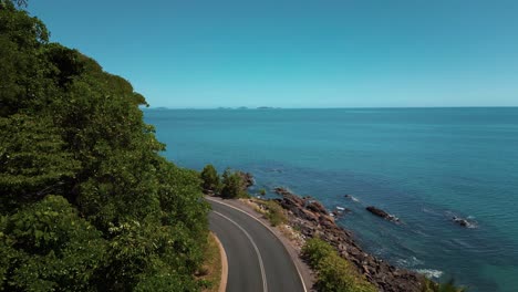 road at tropical daintree rainforest beach, cape tribulation