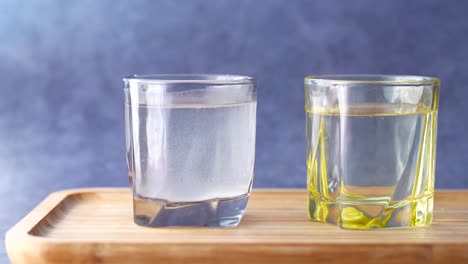 water and oil in two separate glasses