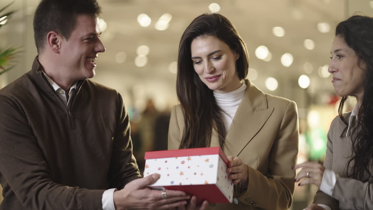 Woman's joyful reaction to a surprise gift from friends