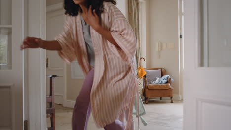 happy little girl chasing mother and daughter play catch running through house mom playing game enjoying fun weekend morning with child 4k footage