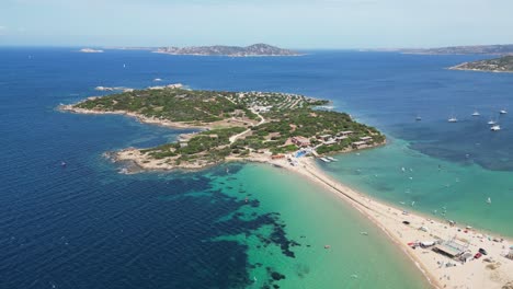 Peninsula-Island-Isolo-dei-Gabbiani-at-Porto-Pollo,-Sardinia,-Italy---4k-Aerial