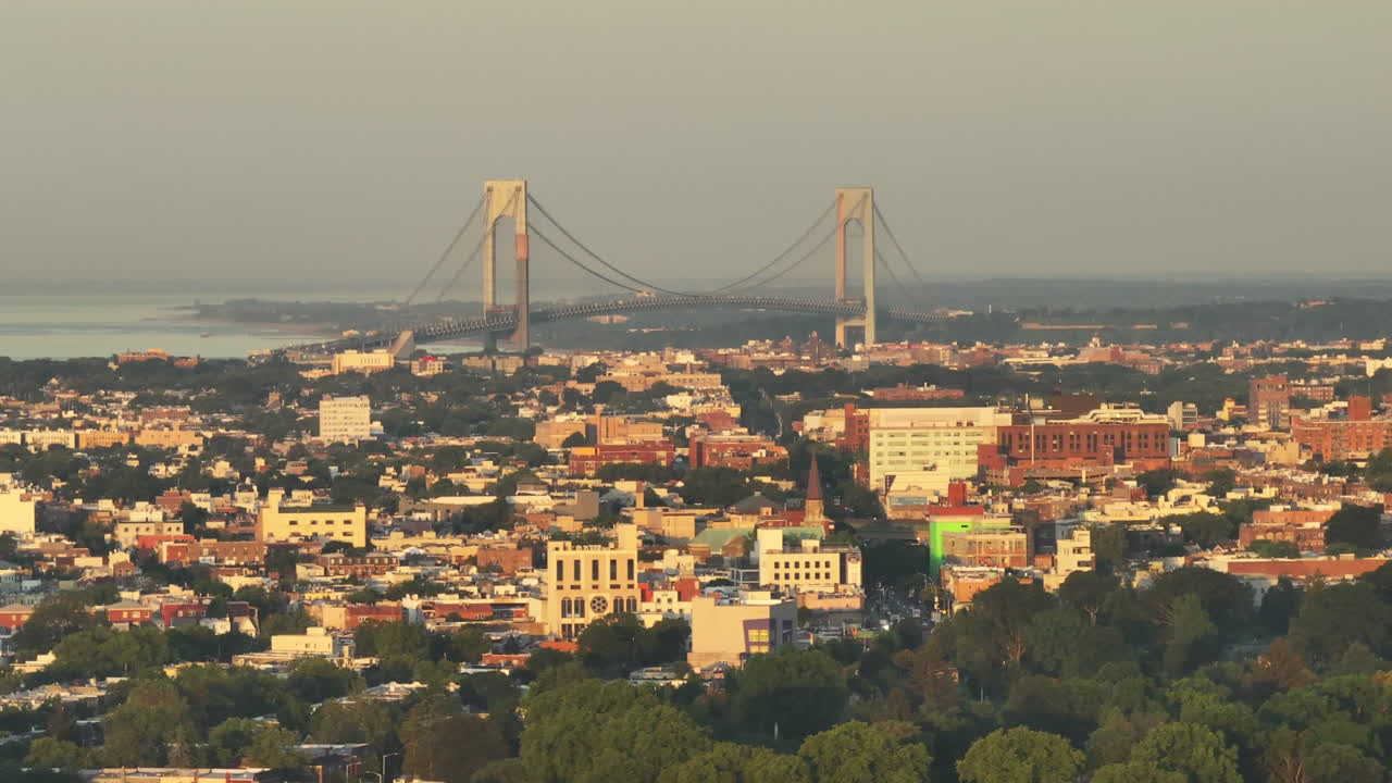 Aerial view of the Verrazzano-Narrows Bridge at sunrise . Shot in Brooklyn, New York City.