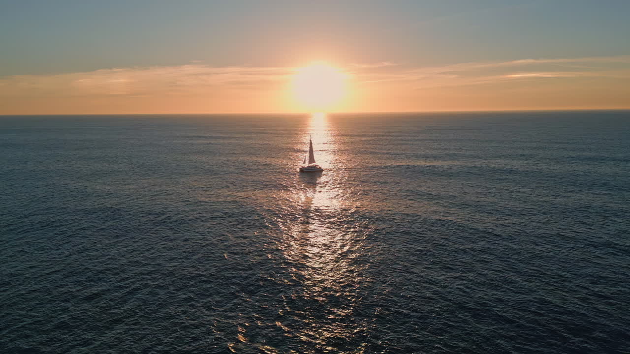 Sailboat floating ocean sunset drone view. Silhouette sailing boat at sunlight